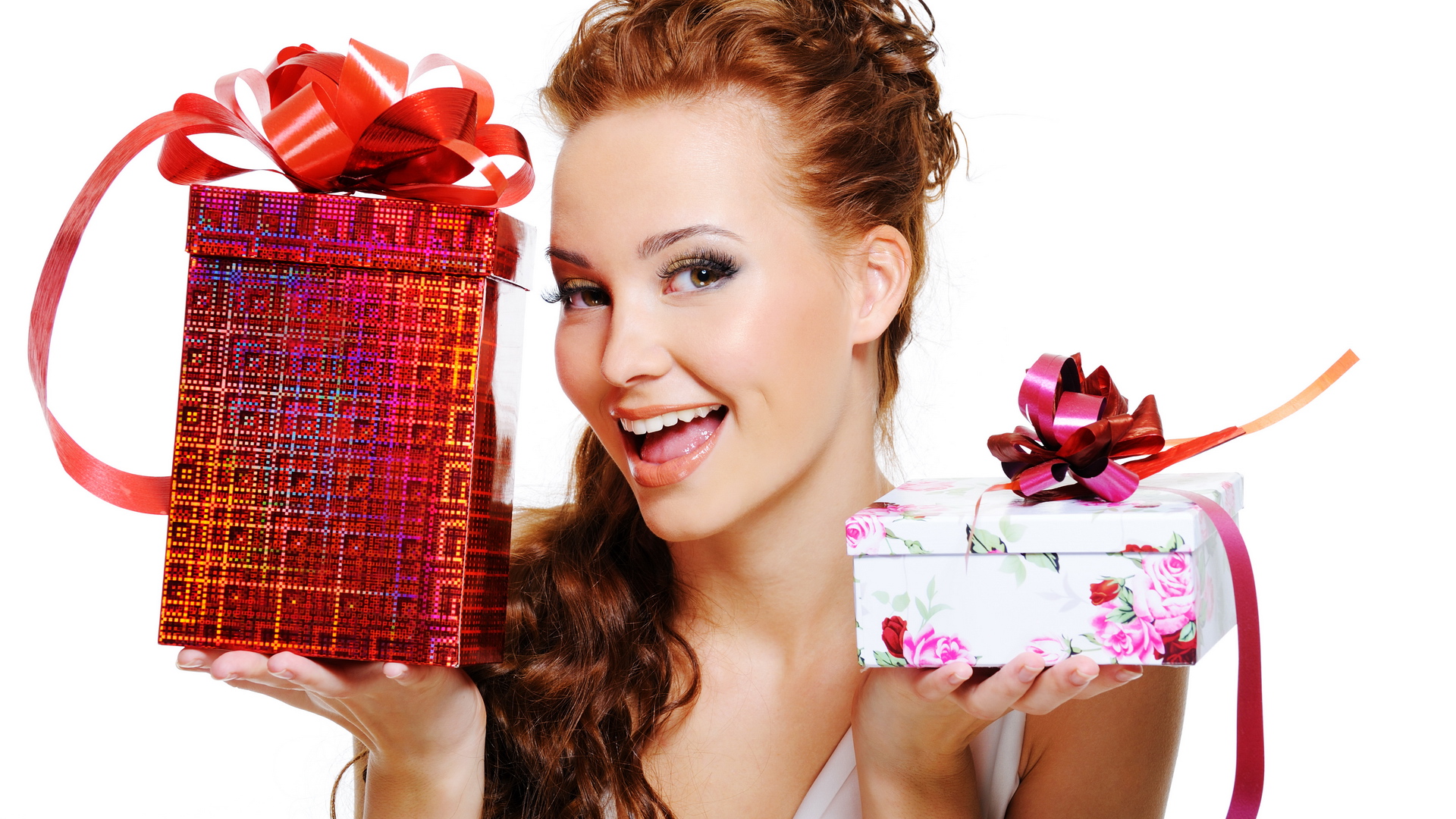 Happy laughing woman choosing between two presents